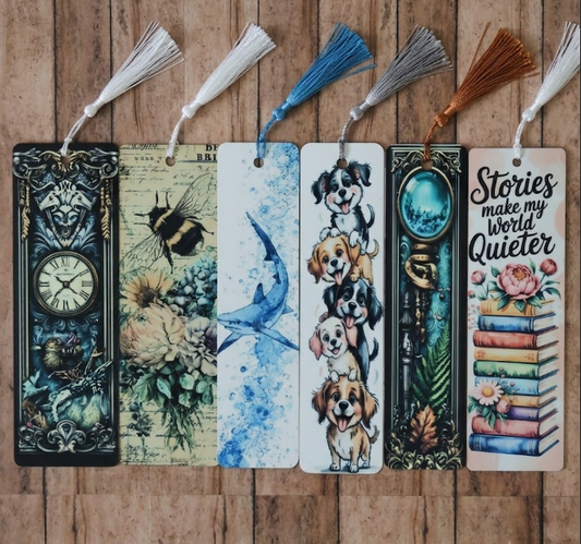 Set of colorful bookmarks with various designs on a wooden surface